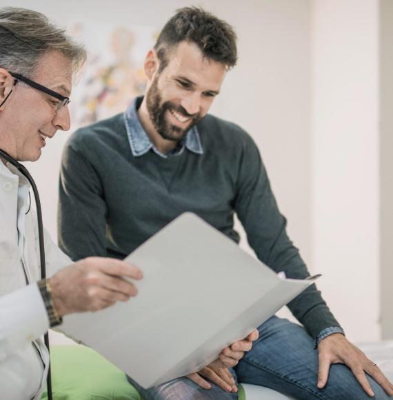 Doctor and male patient discussing his care