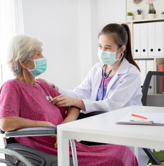 Woman receiving treatment from a healthcare professional