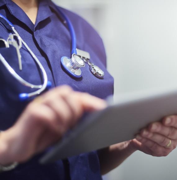 Nurse using a tablet PC