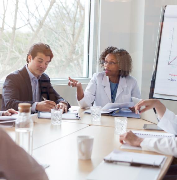 Health professionals discussing in a group setting