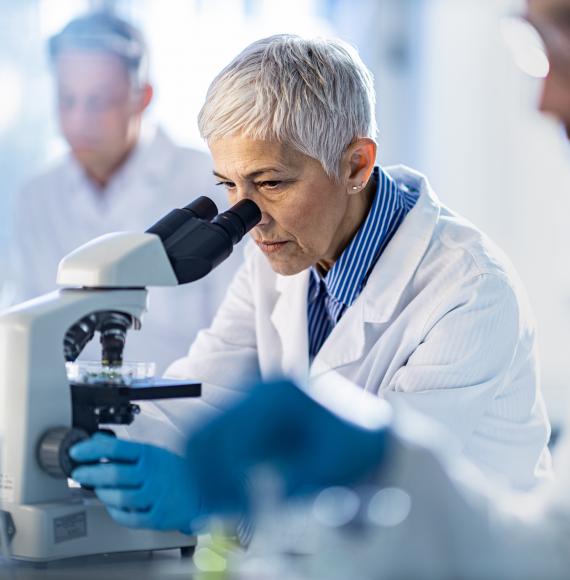 Researcher using lab equipment