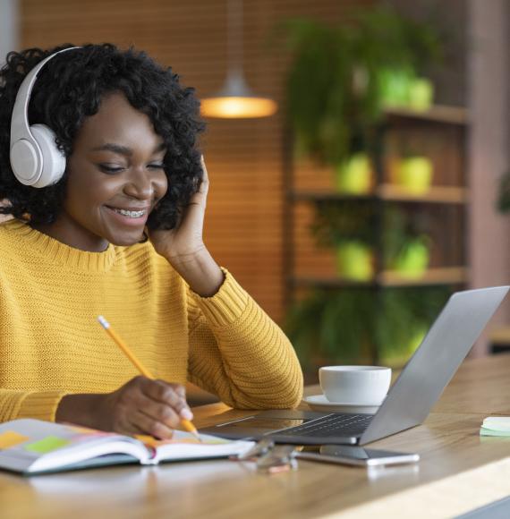 Young woman listening to online training