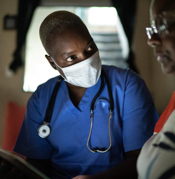 Nurse with a patient in a home visit