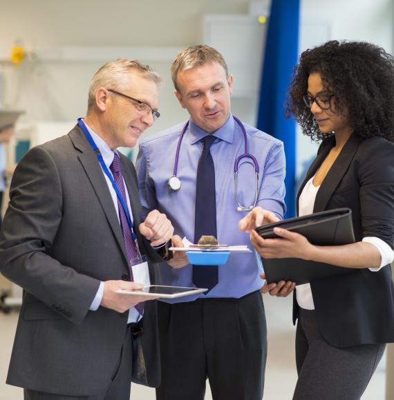 Hospital administrative team discussing a patient record