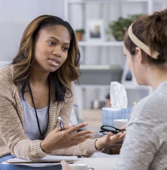 Counsellor speaking with teenager