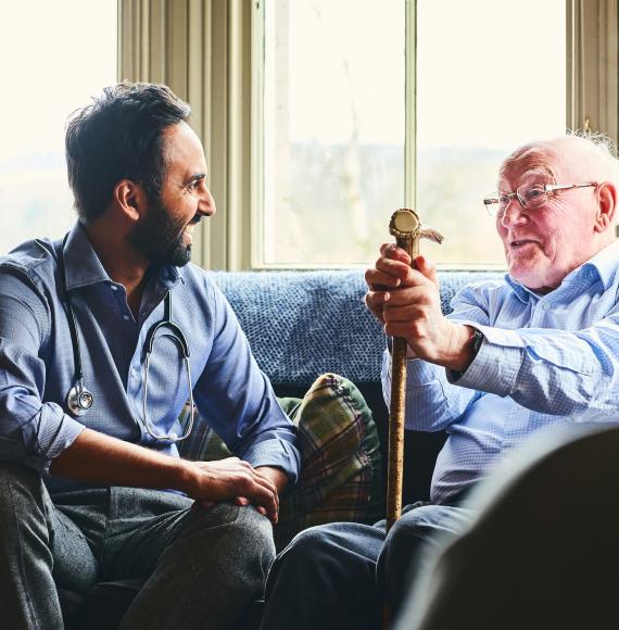 Doctor talking to an elderly care home resident