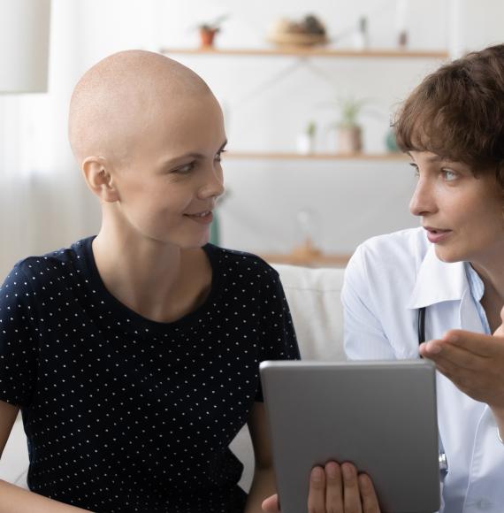 Cancer patient talking with a doctor