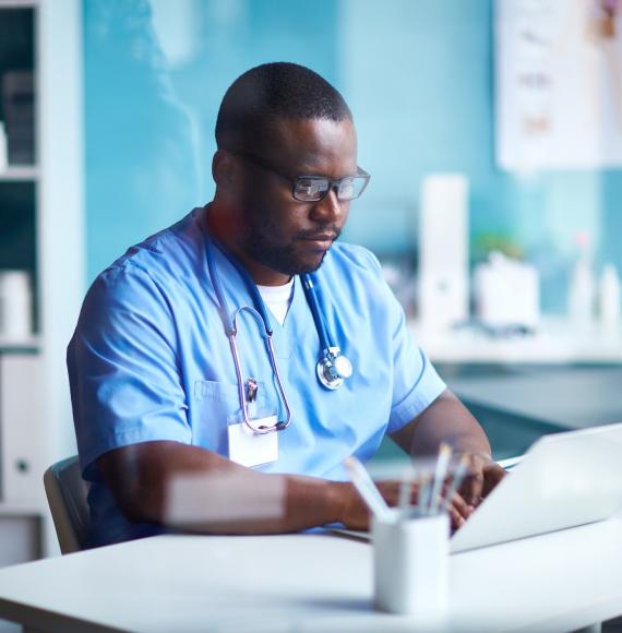 Nurse using a laptop to talk with patients