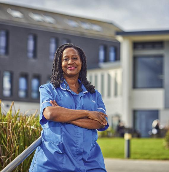 Nurse standing outside of a hospital