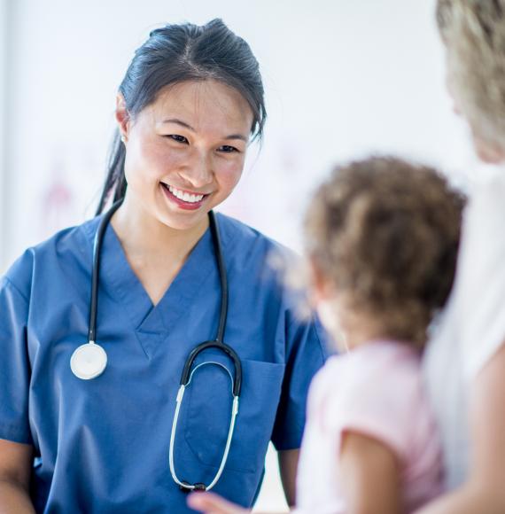 Female nurse seeing a young patient