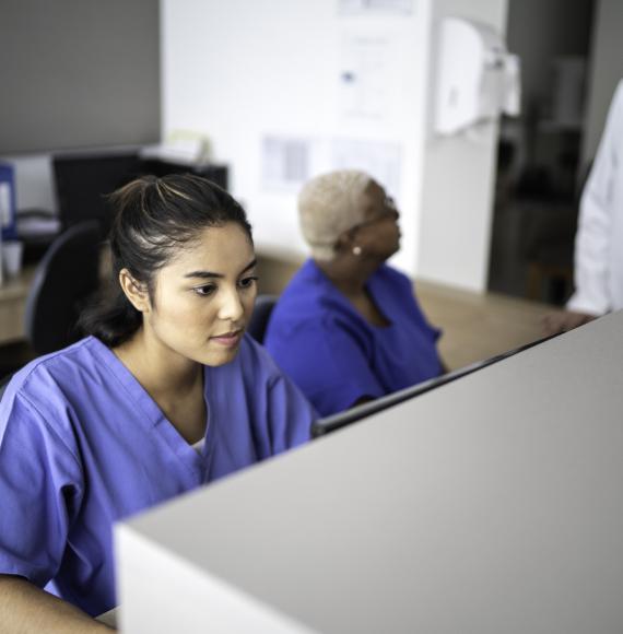 Hospital receptionist at her desk