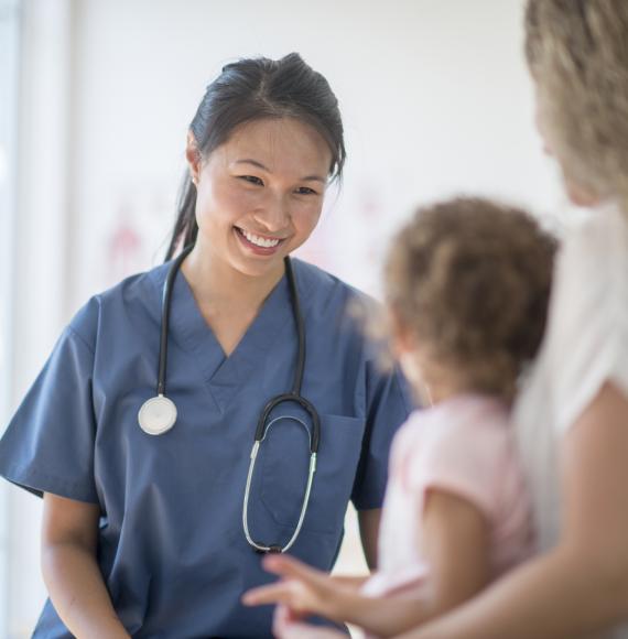 Female nurse with a young child