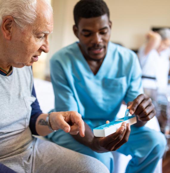 Young health worker helping a patient