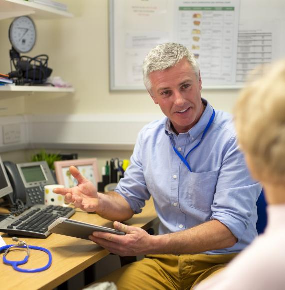GP speaking with a patient during an appointment