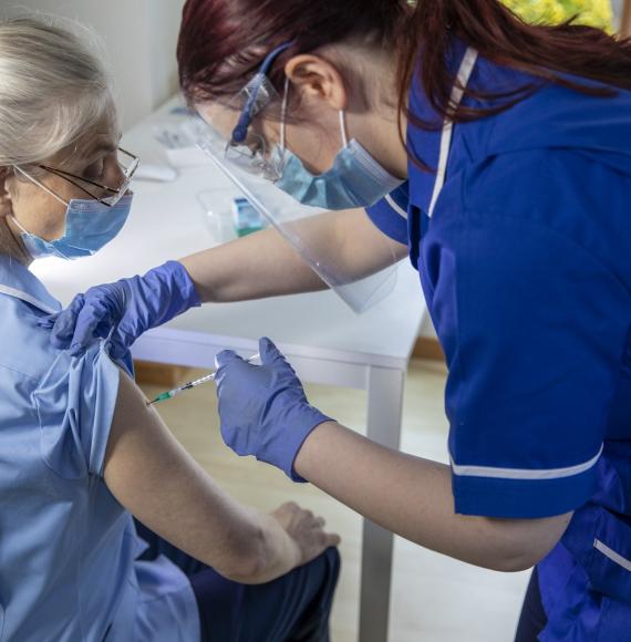 nurse receiving vaccine 