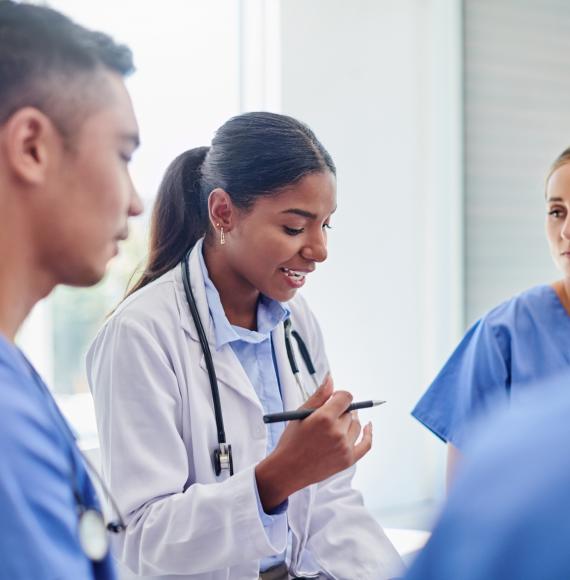 Doctors and nurses talking in a group