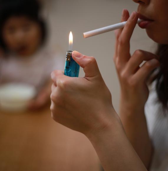 adult smoking near child 