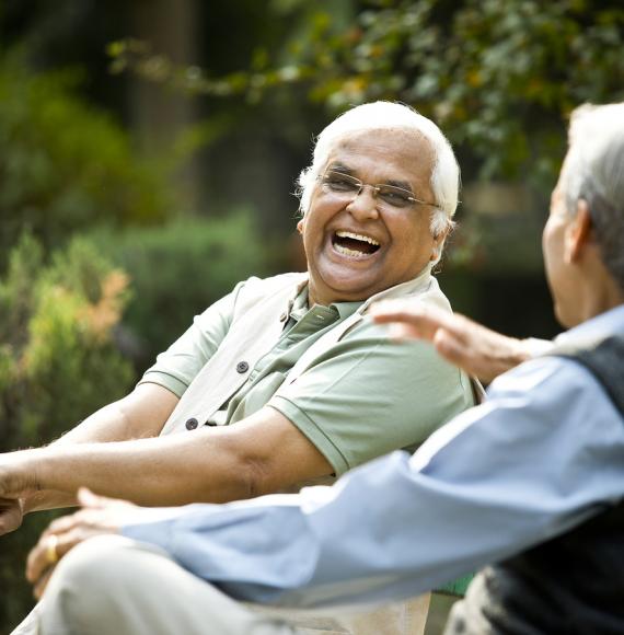 two elderly men laughing