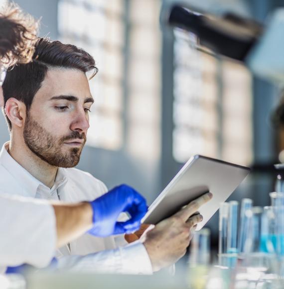 Lab workers looking at some data