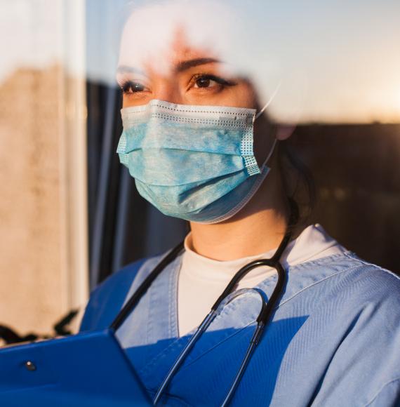 nurse looking out of window 