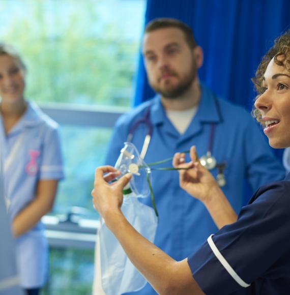 nhs nurse giving training 