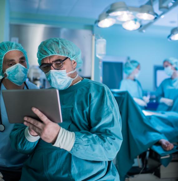 two surgeons using tablet in theatre 