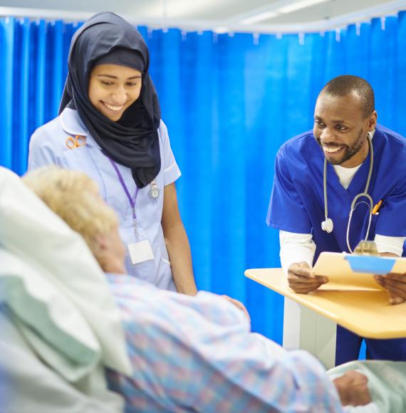 Nurses talking with a patient