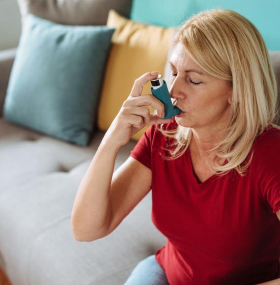 Woman using inhaler