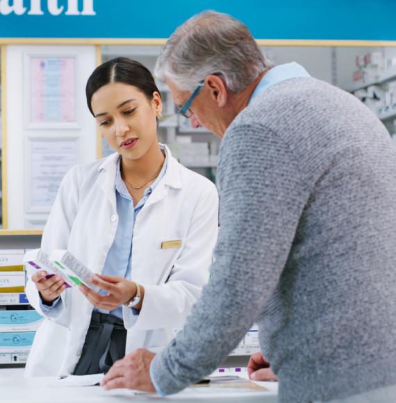 Pharmacist helping man