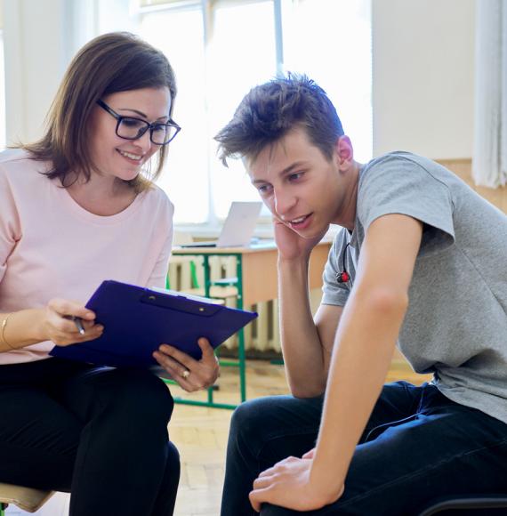 Woman helping student 