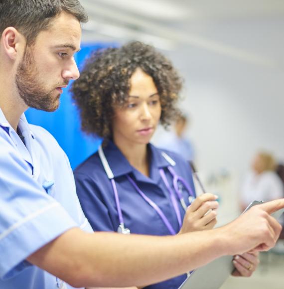 Nurses using a digital screen