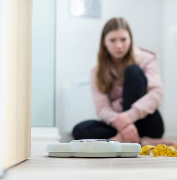 Girl looking at scales 