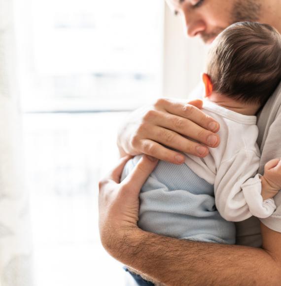 Dad holding baby