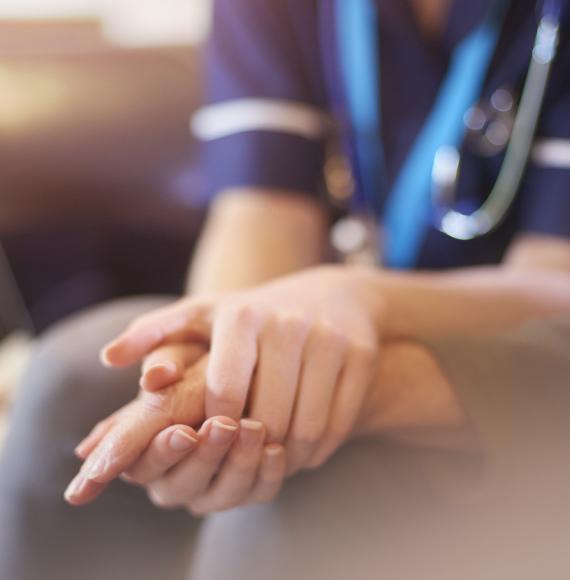 Nurse consoling patient