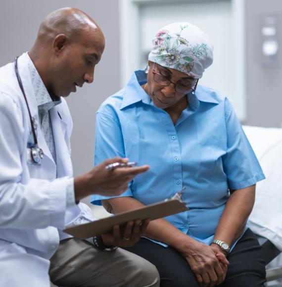 Black woman with cancer having medical consultation