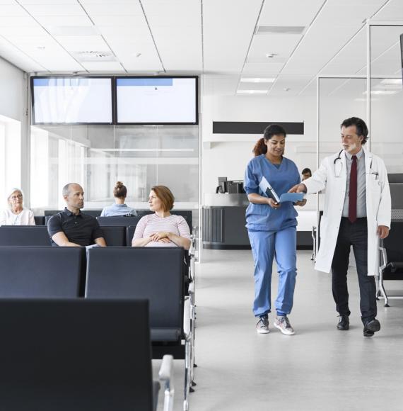 Clinicians walking through waiting room