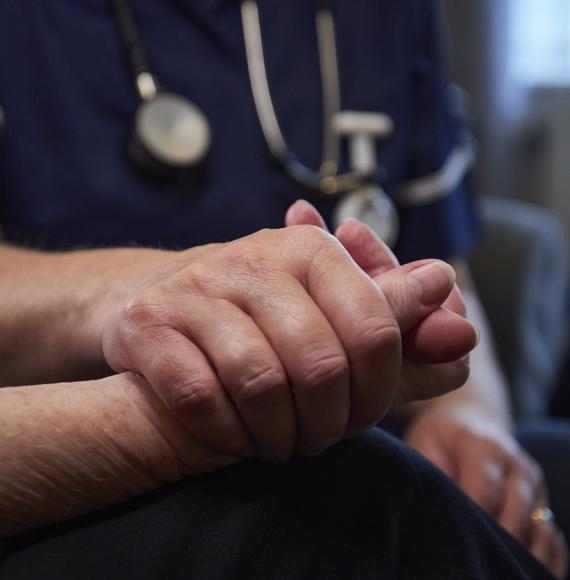 Nurse comforting patient