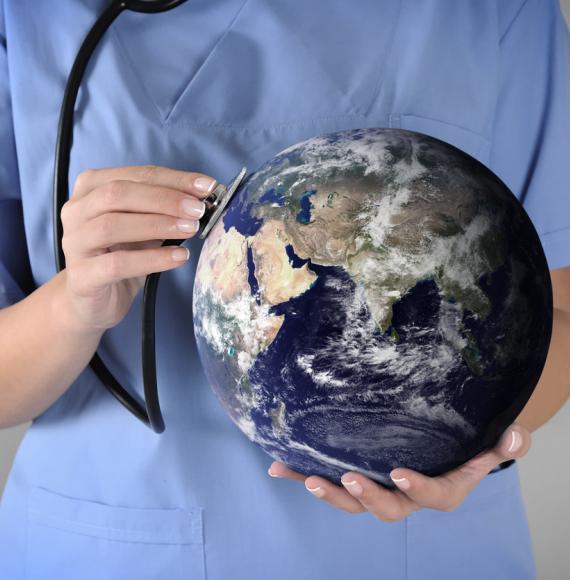 Clinician holding a globe