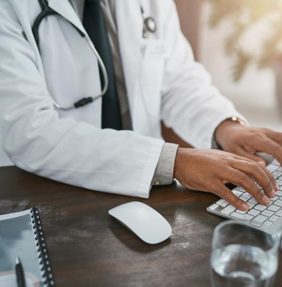 physician at desk, via Istock 