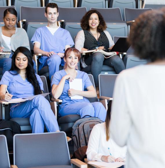 Healthcare educator teaches class of medical students