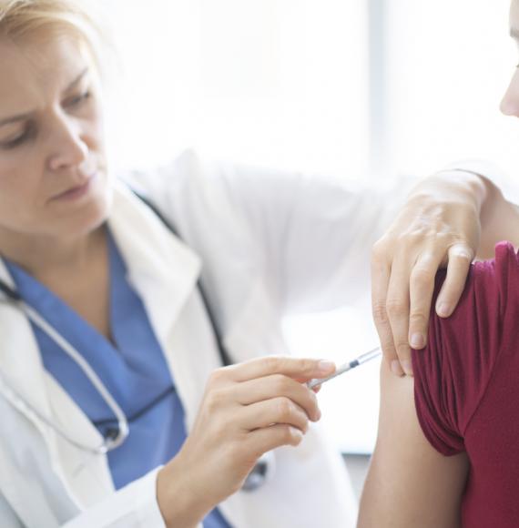 Teenage girl getting vaccinated