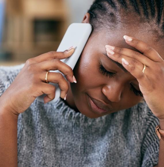 Woman struggling with mental health on phone call