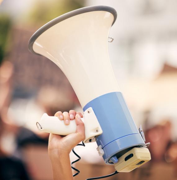 Protester holding a megaphone during a rally
