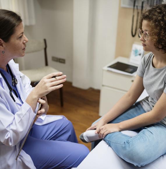 Clinician talking to female patient