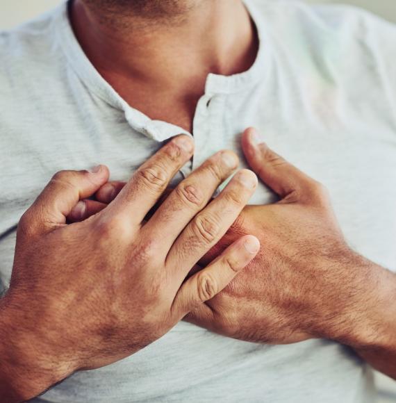 Man holding his chest