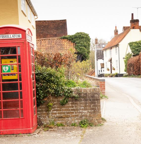 Defibrillator being used in an old phone box