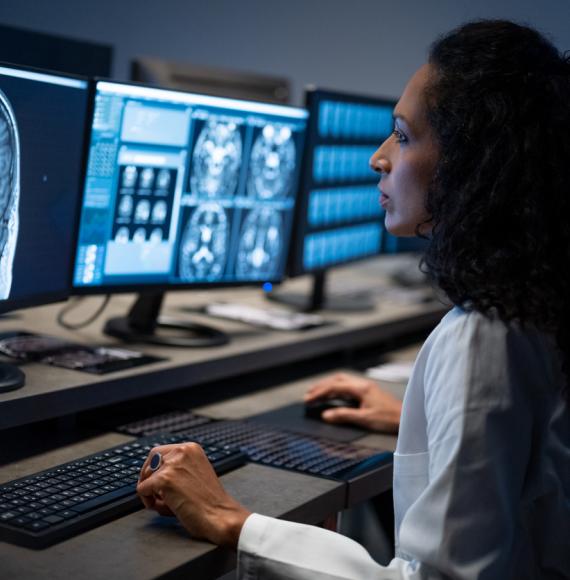 Female radiologist analysing the MRI image of the head