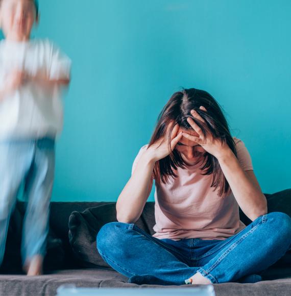 Stressed mother having problem with noisy son