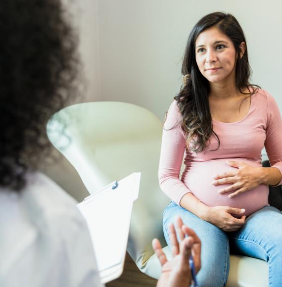 Pregnant woman and doctor