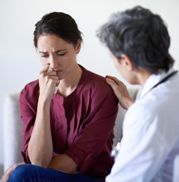 Health professionals with stressed patient